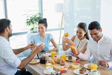 Business colleagues interacting with each other 