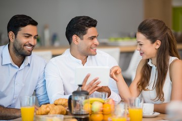 Business colleagues interacting with each other 