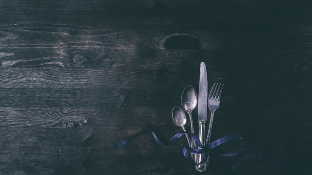 Cutlery on a wooden background