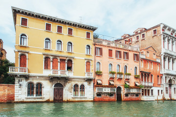 View of typical Venetian canal and colourful buildings in Venice, Italy