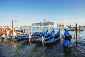 Fototapeta na wymiar Gondolas on Grand canal in Venice, San Giorgio Maggiore church. San Marco.