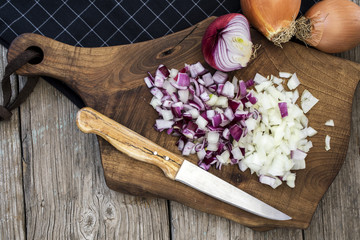 Chopped onions on chopping board