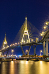Obraz premium Night cityscape of Bhumibol Bridge across Chao Phraya River, Bangkok, Thailand