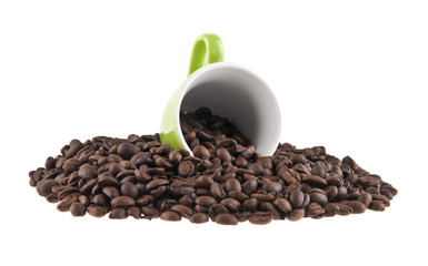 grains of coffee and green cup