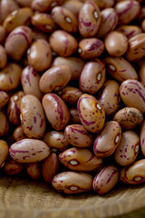 pinto beans on wooden surface