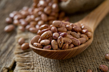 pinto beans on wooden surface