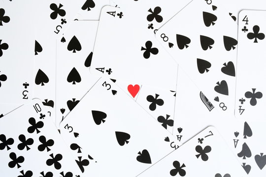 black playing cards with a red heart