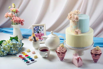 Spring morning still life cake in pastel colours with flowers