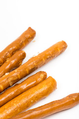 Closeup macro of baked grissini with copy space over white background