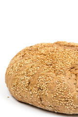 Round domestic bread isolated over white background