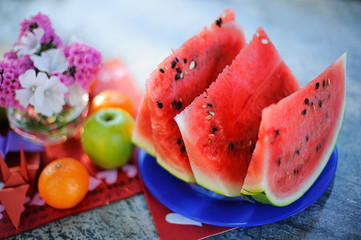 the juicy cut water-melon on a table