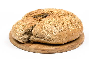 Sliced round domestic bread isolated over white background