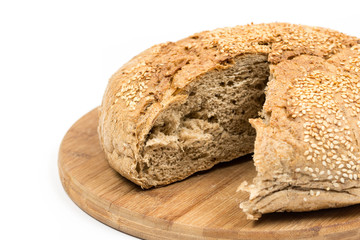 Sliced round domestic bread isolated over white background