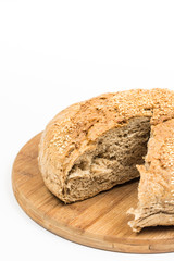Sliced round domestic bread isolated over white background