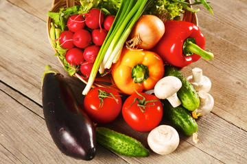 Composition with assorted raw organic vegetables wooden table