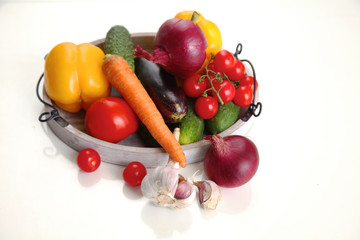 Composition with assorted raw organic vegetables on table