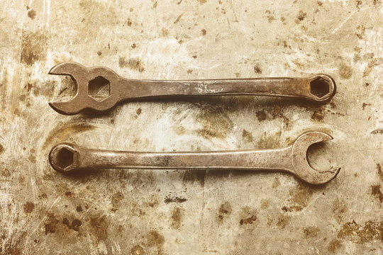 Sepia toned image of old wrenches