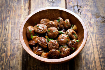 Fried mushrooms with onion in bowl