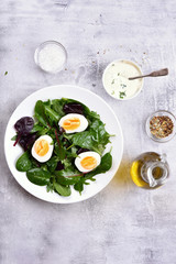 Healthy mix salad with eggs and greens