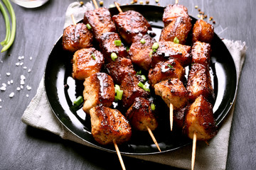 Grilled pork kebabs on plate