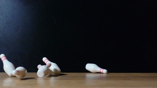 Super slow motion footage with falling skittles with bowling ball.