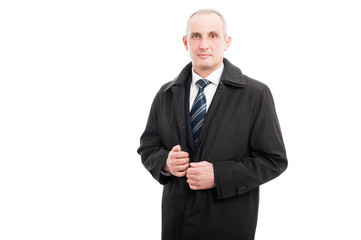 Portrait of middle age business man wearing raincoat