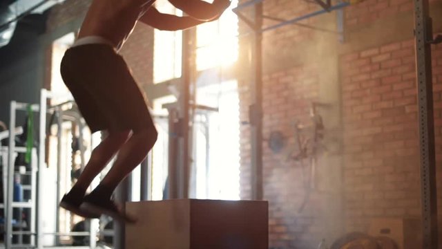 Man doing box jumps on the healthy club 