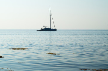 Fototapeta premium The ship in the morning calm sea