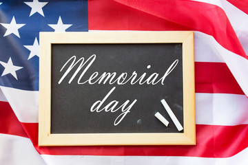 memorial day words on chalkboard and american flag