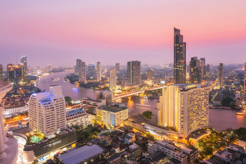 Naklejka premium Aerial view cityscape with Chaophraya river in Bangkok, Thailand.