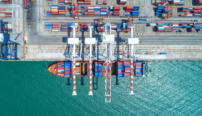 Fototapeta na wymiar container ship in import export and business logistic.By crane ,Trade Port , Shipping, cargo to harbor, Aerial view, Top view.