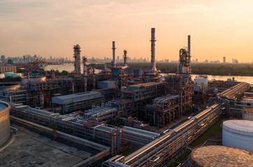 Oil refinery with a background of the city.The factory is located in the middle of nature and no emissions. The area around the air pure.business logistic.Aerial view .Top view.