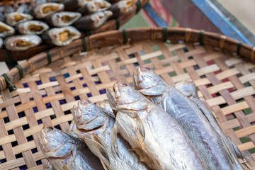 Dried Threadfins fish on basket.