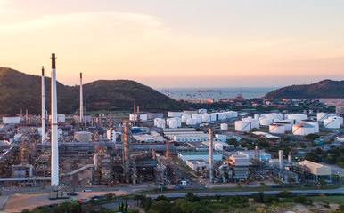 Oil refinery with a background of the city.The factory is located in the middle of nature and no emissions. The area around the air pure.business logistic.Aerial view .Top view.