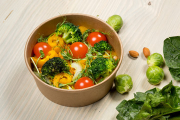 Cooking diet detox salad for vegetarian, vegan food, vitamin snack and health life. Top horizontal view on light wood background and copy space. White overhead flat food photo. 