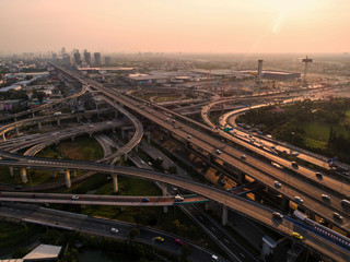 Fototapeta na wymiar Aerial view Road roundabout. Expressway with car lots in the city in Thailand. Street large beautiful downtown. cityscape. Top view.