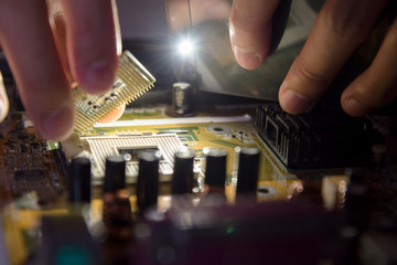 A mainboard ( Main board,cpu motherboard,logic board,system board or mobo board)
close up of electronics circuit board 
