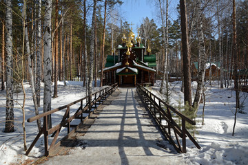 Wooden Russian Orthodox Christian Church of St. Nicholas in Ganina Yama Monastery on early Spring,...