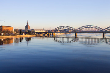 Sunset light over bridge and river in Riga, Latvia