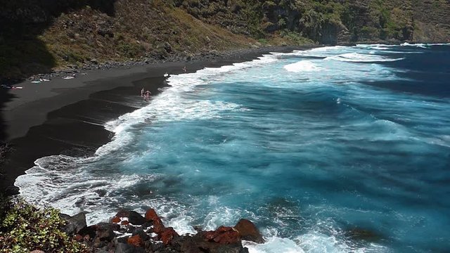Panoramic view of the shore of Nogales beach, with many waves and strong wind, on the island of La Palma, Canary Islands, Spain.Slow Motion