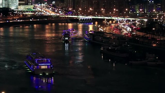 Night streets of Moscow in the spring. View of the building of Novy Arbat Street and the building of the Moscow City Hall