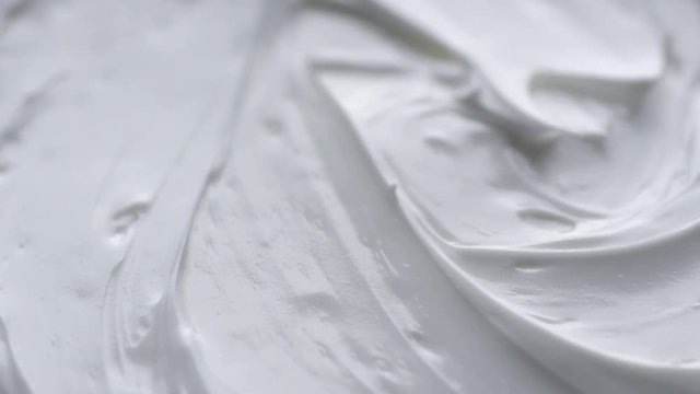 Cosmetics cream with rotate. Close-up shot.
