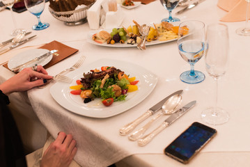 Salad with seafood, octopus, strawberry, citrus and greens