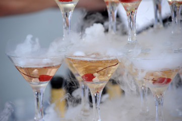 Pyramid of glasses with a champagne close up.
