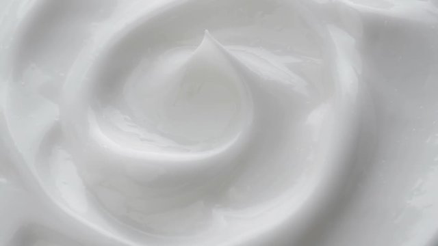 White gentle cosmetic cream. Cosmetics cream with rotate. Close-up shot.