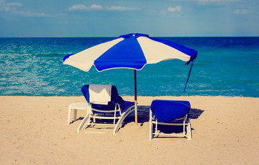 Two chairs on sand beach