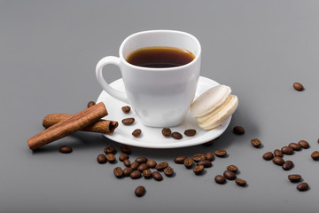 White cup of coffee on a gray background