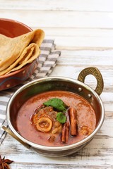 Rogan Josh / Kashmiri Lamb curry served in a Kadai, selective focus