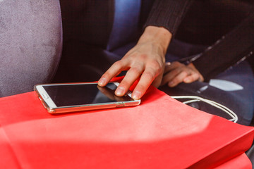 Burglar thief stealing smartphone and bag from car