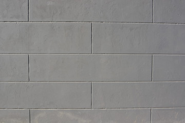 Grey tiled brick wall texture background